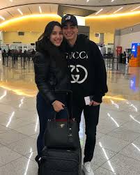 Miguel Almiron's stunning Wag Alexia kisses him goodbye at airport as he  jets off to seal £21m Newcastle switch